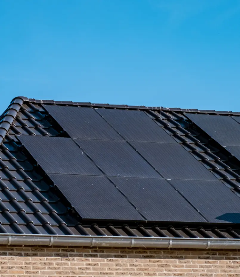 black solar panels on black roof