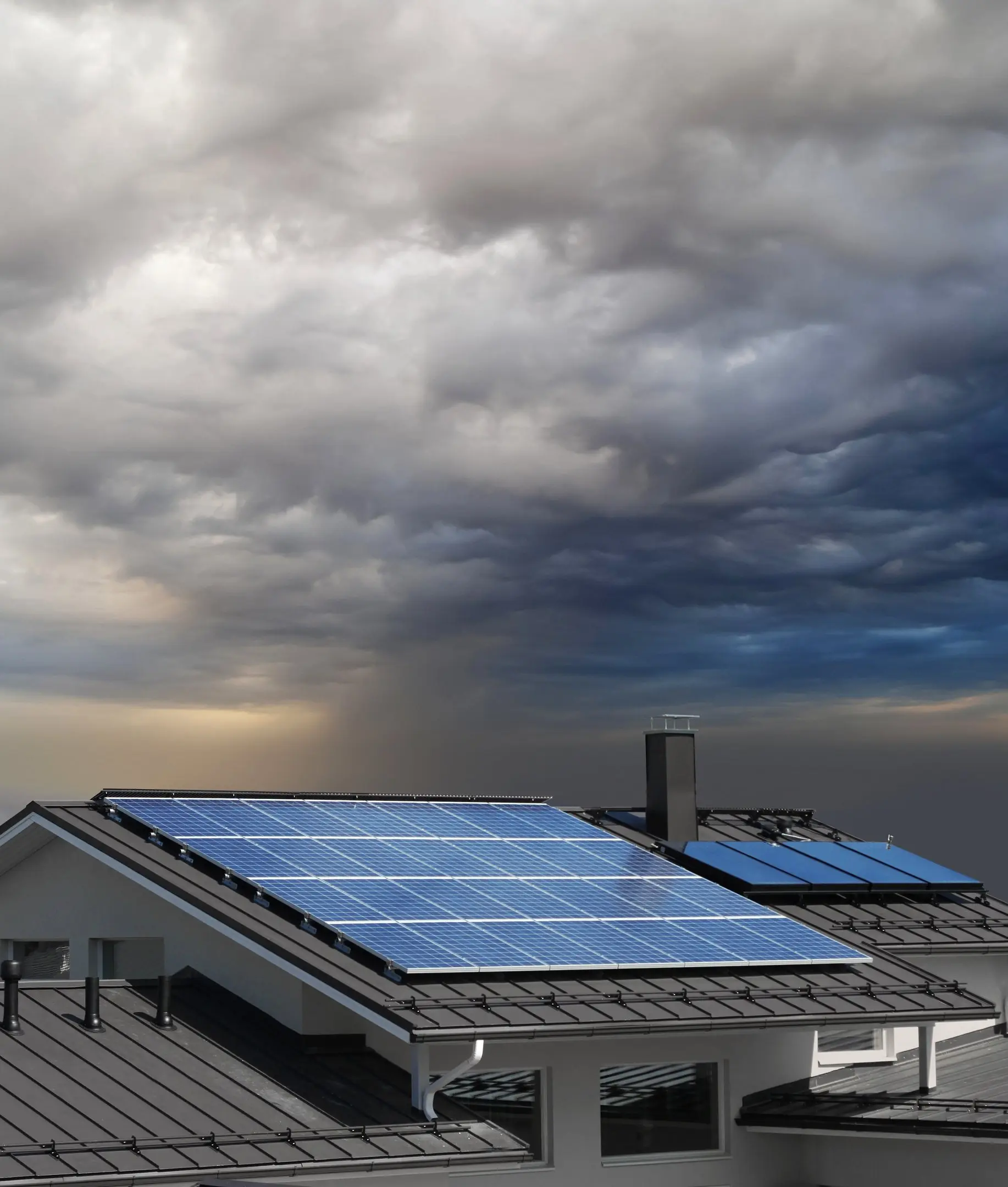 solar panels on roof with dark sky