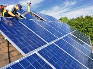 denver solar panel installation company installing solar panels on roof in Denver CO