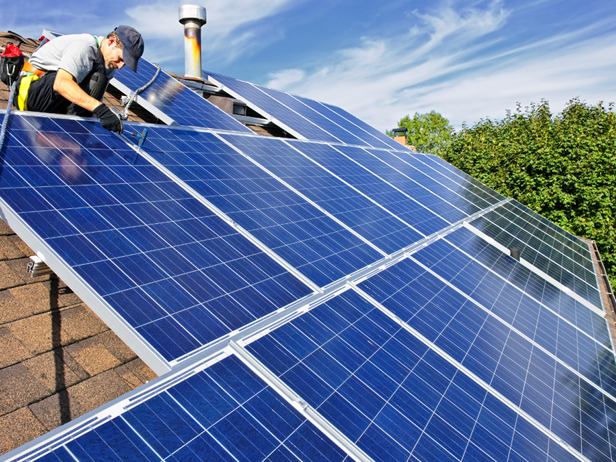 denver solar panel installation company installing solar panels on roof in Denver CO